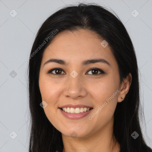 Joyful latino young-adult female with long  brown hair and brown eyes