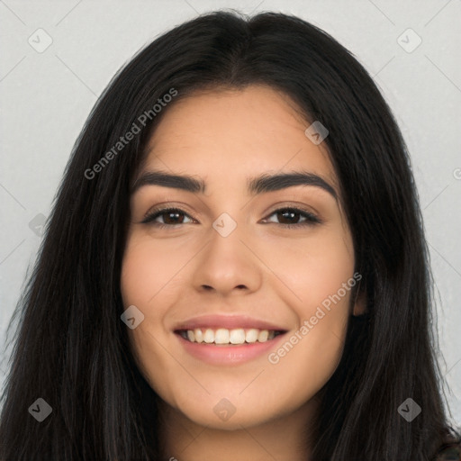 Joyful latino young-adult female with long  black hair and brown eyes