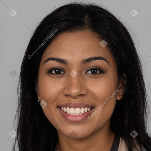 Joyful latino young-adult female with long  brown hair and brown eyes