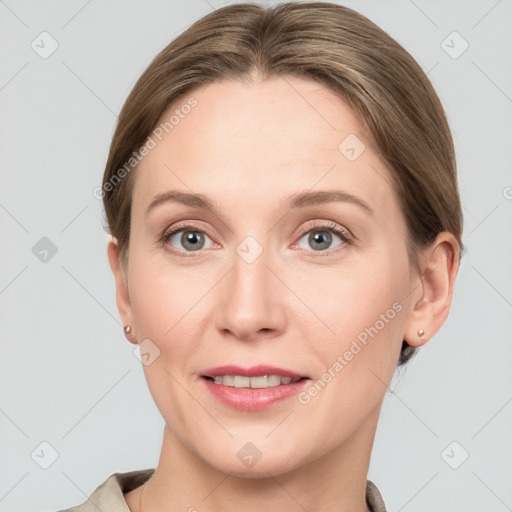 Joyful white young-adult female with short  brown hair and grey eyes