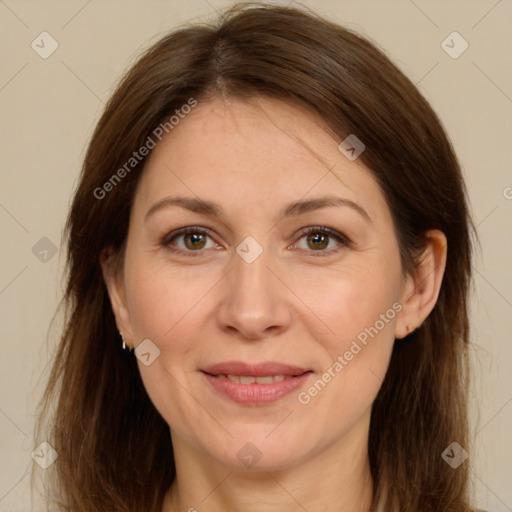 Joyful white adult female with long  brown hair and brown eyes