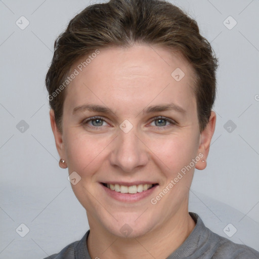 Joyful white adult female with short  brown hair and grey eyes