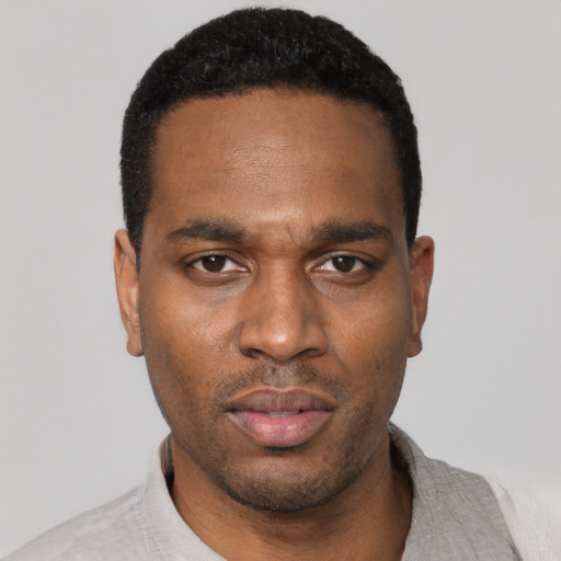 Neutral black young-adult male with short  black hair and brown eyes