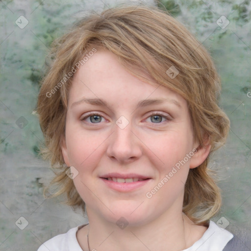 Joyful white young-adult female with medium  brown hair and blue eyes