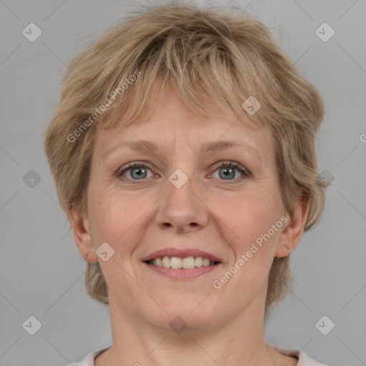 Joyful white adult female with medium  brown hair and grey eyes