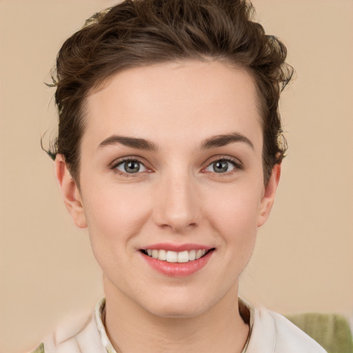 Joyful white young-adult female with short  brown hair and green eyes