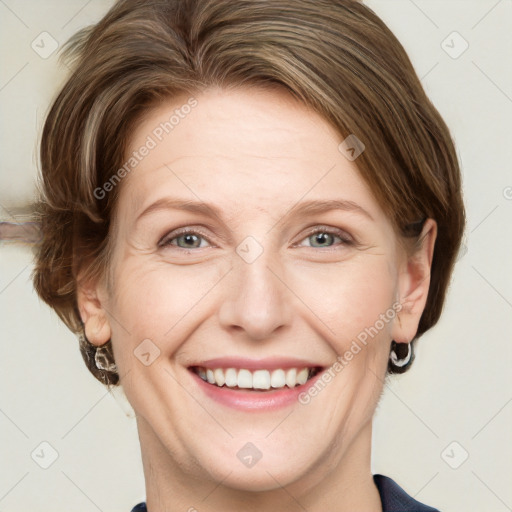 Joyful white adult female with medium  brown hair and blue eyes