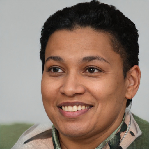 Joyful latino adult female with short  brown hair and brown eyes