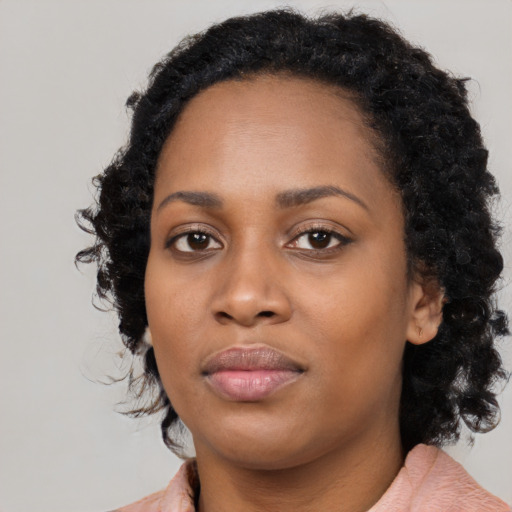 Neutral black young-adult female with medium  black hair and brown eyes