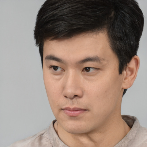 Neutral white young-adult male with short  black hair and brown eyes