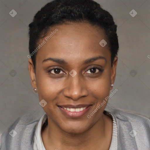 Joyful black young-adult female with short  black hair and brown eyes