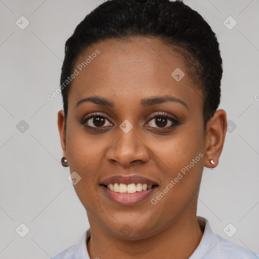 Joyful black young-adult female with short  black hair and brown eyes