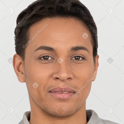 Joyful latino young-adult male with short  brown hair and brown eyes