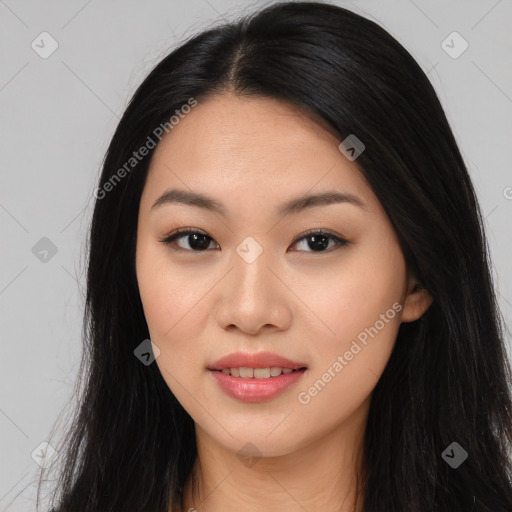 Joyful asian young-adult female with long  black hair and brown eyes