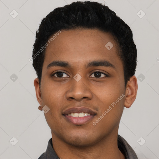 Joyful black young-adult male with short  black hair and brown eyes