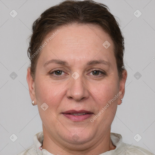 Joyful white adult female with short  brown hair and grey eyes