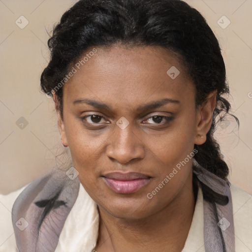 Joyful black adult female with short  brown hair and brown eyes