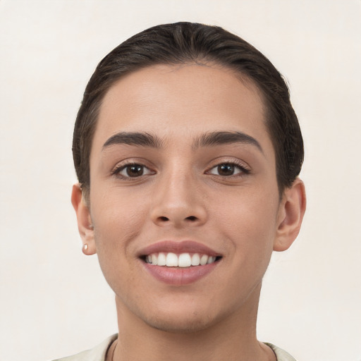 Joyful white young-adult female with short  brown hair and brown eyes