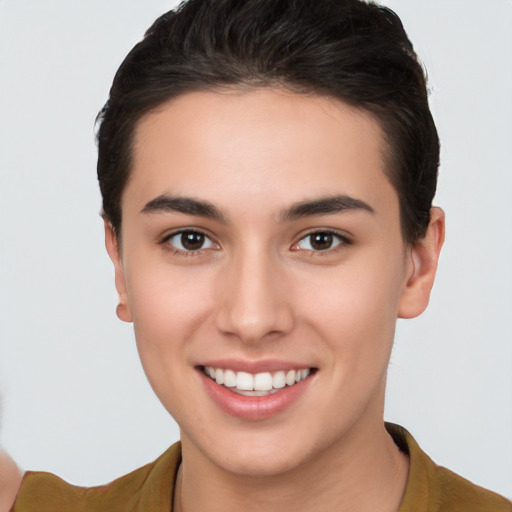 Joyful white young-adult female with short  brown hair and brown eyes