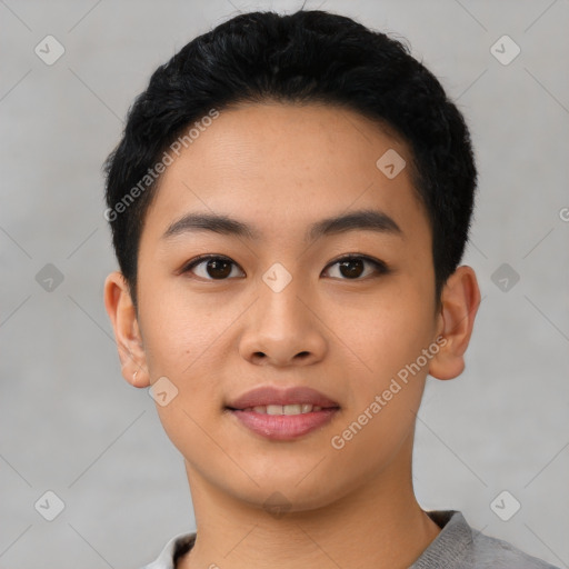 Joyful asian young-adult male with short  black hair and brown eyes