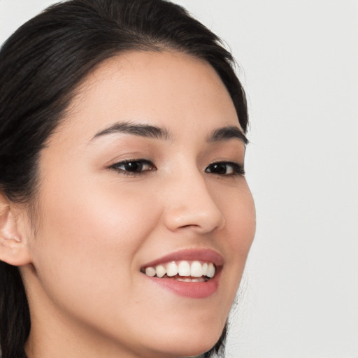 Joyful white young-adult female with medium  black hair and brown eyes