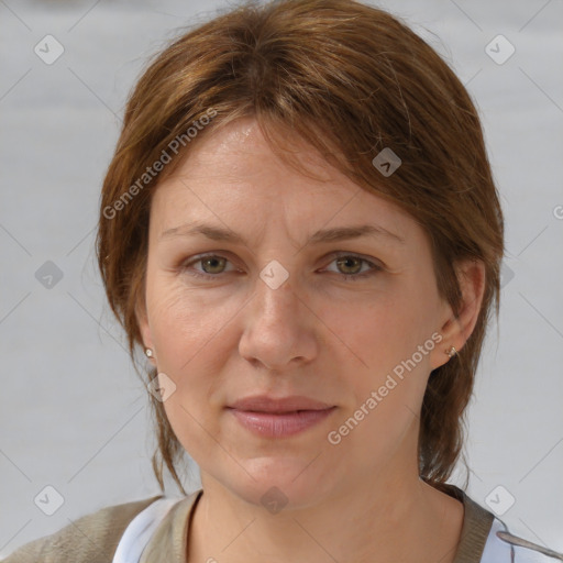 Joyful white adult female with medium  brown hair and grey eyes