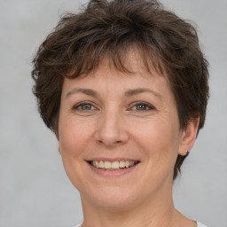 Joyful white adult female with short  brown hair and brown eyes