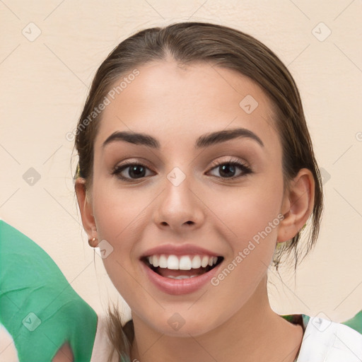 Joyful white young-adult female with medium  brown hair and brown eyes