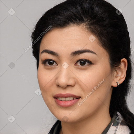 Joyful latino young-adult female with long  brown hair and brown eyes