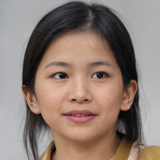 Joyful asian child female with medium  brown hair and brown eyes