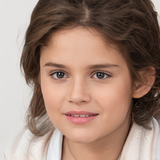 Joyful white child female with medium  brown hair and brown eyes