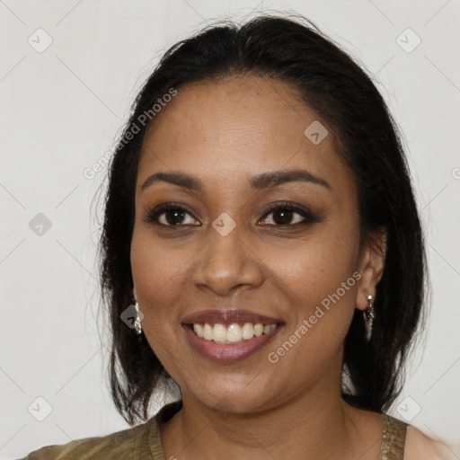 Joyful black young-adult female with medium  brown hair and brown eyes