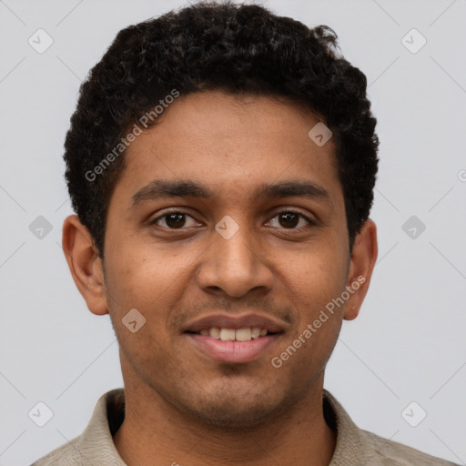Joyful black young-adult male with short  brown hair and brown eyes