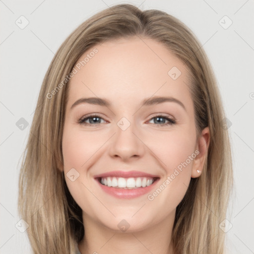 Joyful white young-adult female with long  brown hair and grey eyes