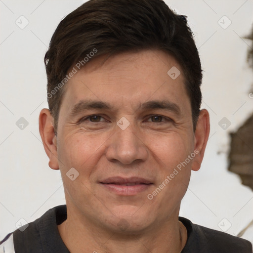 Joyful white adult male with short  brown hair and brown eyes