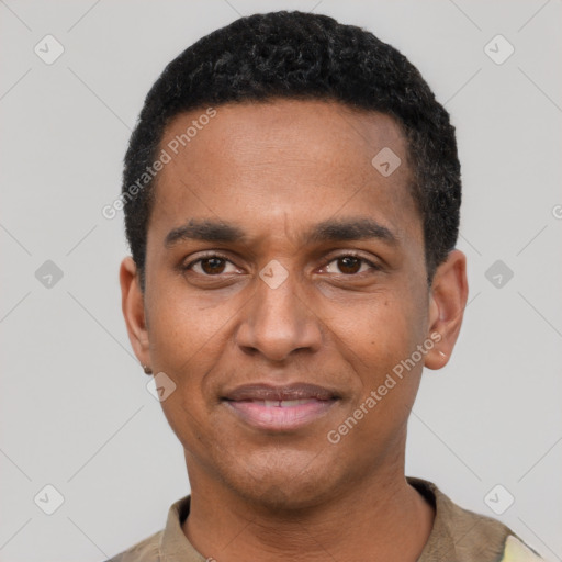 Joyful black young-adult male with short  black hair and brown eyes