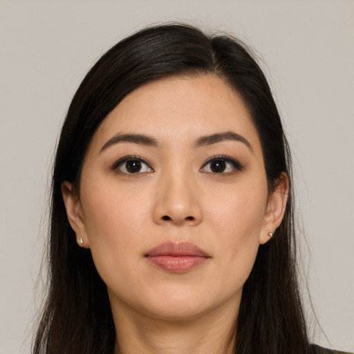 Neutral asian young-adult female with long  brown hair and brown eyes