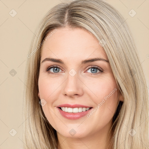 Joyful white young-adult female with long  brown hair and green eyes