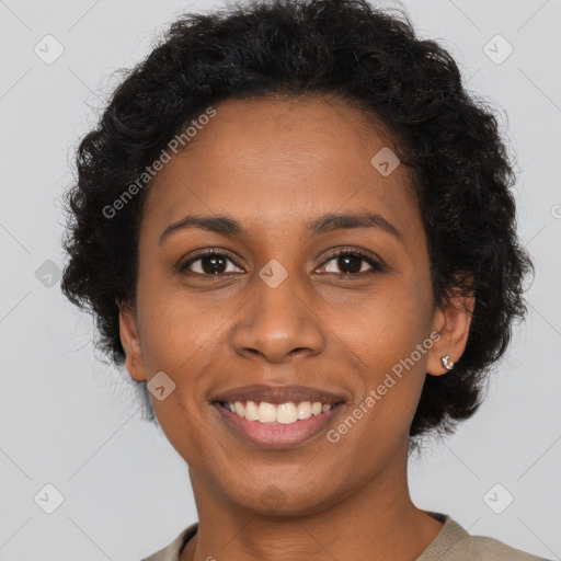 Joyful black young-adult female with long  brown hair and brown eyes