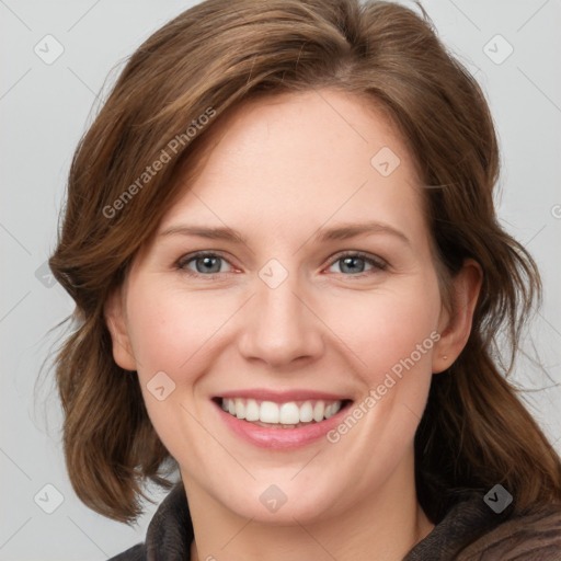 Joyful white young-adult female with medium  brown hair and blue eyes