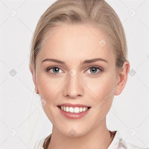 Joyful white young-adult female with medium  brown hair and blue eyes