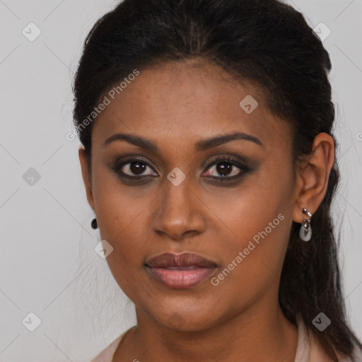 Joyful black young-adult female with long  brown hair and brown eyes