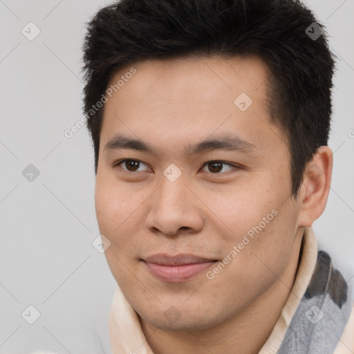 Joyful asian young-adult male with short  brown hair and brown eyes