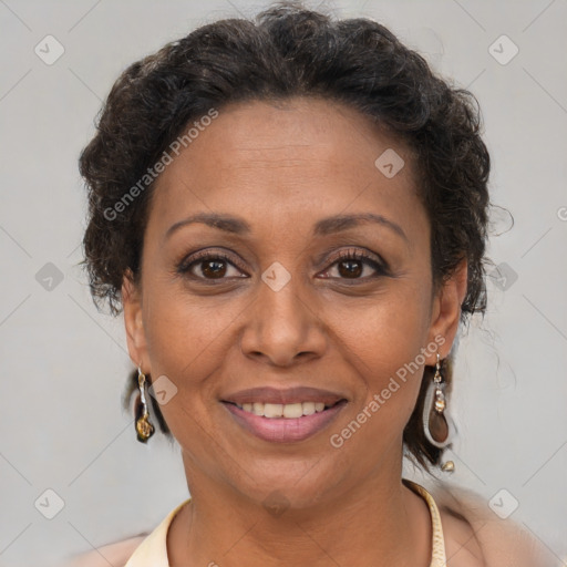 Joyful black adult female with short  brown hair and brown eyes