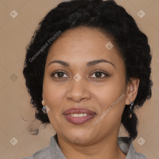 Joyful black adult female with medium  brown hair and brown eyes