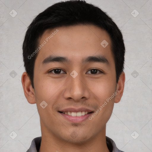 Joyful asian young-adult male with short  black hair and brown eyes