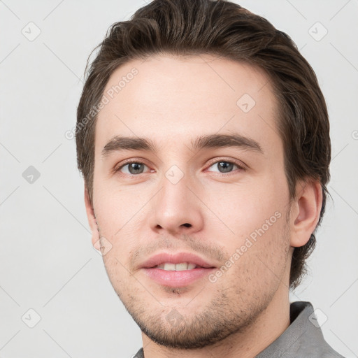 Neutral white young-adult male with short  brown hair and grey eyes