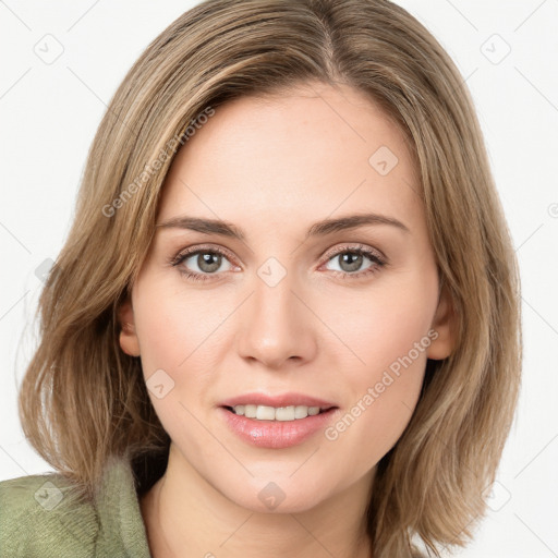 Joyful white young-adult female with long  brown hair and green eyes