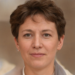 Joyful white adult female with short  brown hair and brown eyes