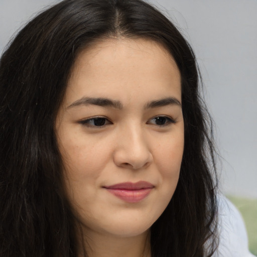 Joyful asian young-adult female with long  brown hair and brown eyes